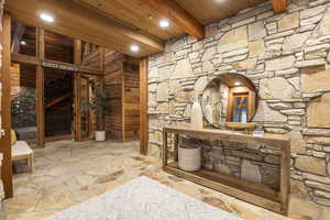 Wine cellar with beam ceiling and wood ceiling