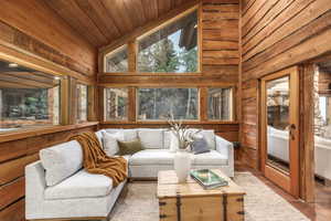 Sunroom with wooden ceiling and vaulted ceiling