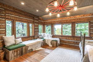 Interior space with vaulted ceiling and wood ceiling