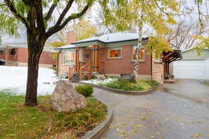 View of front of house featuring an outbuilding and a garage