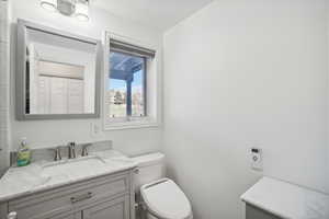 Bathroom featuring vanity and toilet