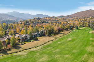 Birds eye view of property with a mountain view