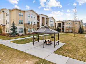 Surrounding community featuring a lawn and a gazebo