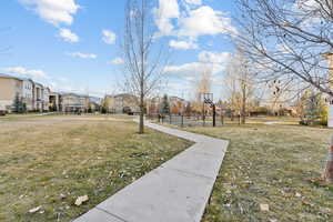 View of yard with basketball court