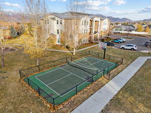 Exterior space with a mountain view and tennis court