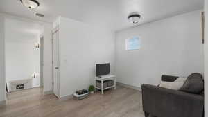 Sitting room with light wood-type flooring