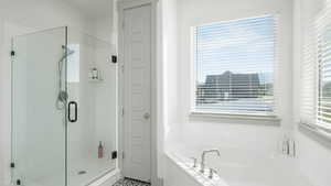 Bathroom featuring separate shower and tub