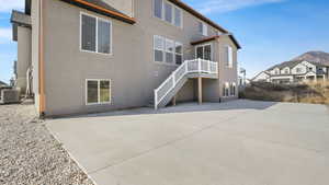 Back of property featuring a patio area and cooling unit