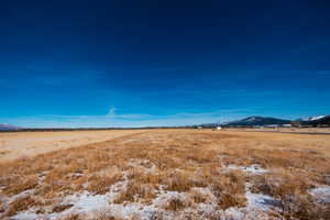 Property view of mountains with a rural view