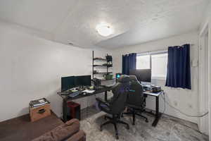 Office featuring a textured ceiling