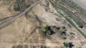 Aerial view of property and surrounding area with a desert landscape and rural landscape