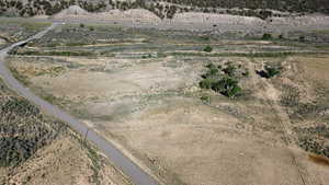 Aerial view of property and surrounding area with rural landscape and a desert landscape