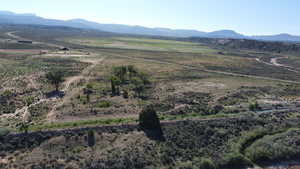 View of mountain background featuring rural landscape