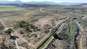 Aerial overview of property's location featuring rural landscape and mountains