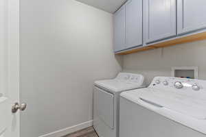 Clothes washing area with cabinets, independent washer and dryer