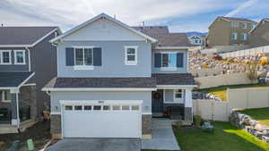 View of front of home featuring a garage