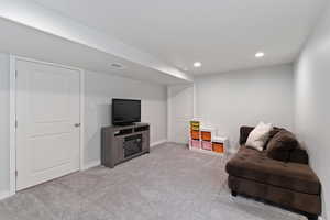 Living area with light carpet