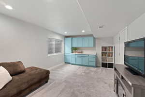 Living room featuring light colored carpet