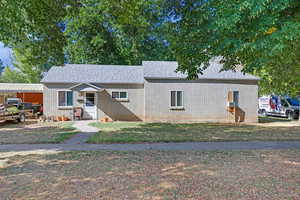 View of front of property with a front yard