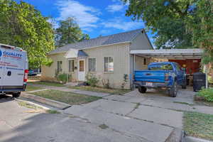 View of front of property featuring a carport