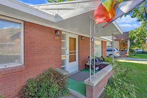 View of patio with covered porch