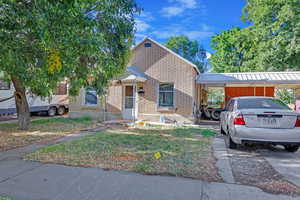 View of front facade with a carport