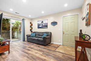 Living room with hardwood / wood-style floors