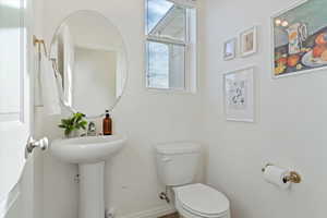 Bathroom featuring toilet and sink