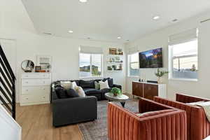 Living room with light wood-type flooring