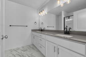 Bathroom with vanity and an enclosed shower