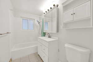 Full bathroom featuring tile patterned floors, vanity, shower / bathtub combination, and toilet