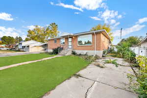 View of front of property with a front lawn