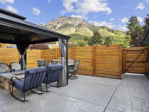 View of patio / terrace featuring a gazebo and a mountain view