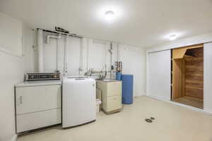 Laundry room with 3 large cedar closets and floor drain