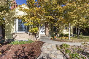 Front view of home with mulched beds and walkways