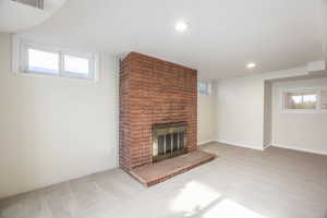 Basement family room with wood-burning fireplace