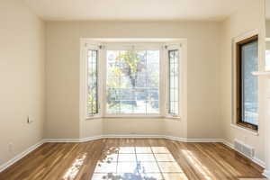 Living room bay window and hardwood floors