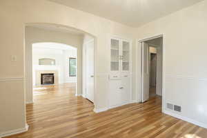 View from dining room into living room (left) and bedroom wing (right)