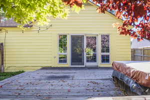 French-door entrance to master bedroom suite from deck and hot tub