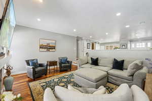 Living room featuring light hardwood / wood-style flooring and ornamental molding