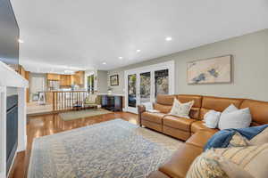 Living room with light hardwood / wood-style floors