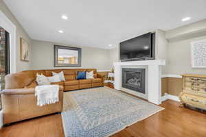 Living room with wood-type flooring