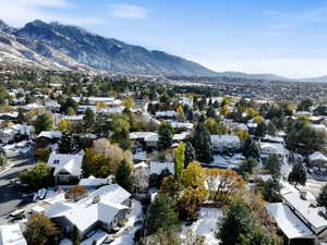 Birds eye view of property with a mountain view