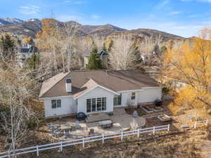 Rear view of house featuring a mountain view and a patio (east side to enjoy sunrise)