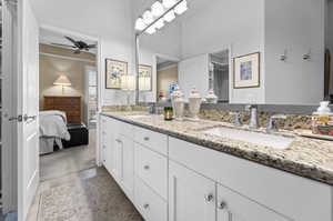 Bathroom featuring ceiling fan and vanity