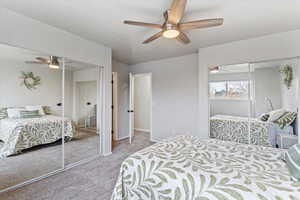 Bedroom featuring ceiling fan and light carpet