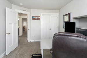 Office area featuring light colored carpet