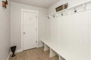 Mudroom featuring light wood-type flooring