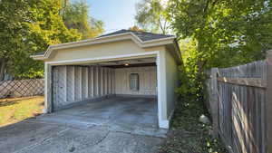 Garage featuring a carport