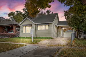 View of front of house with a yard and extra large  garage